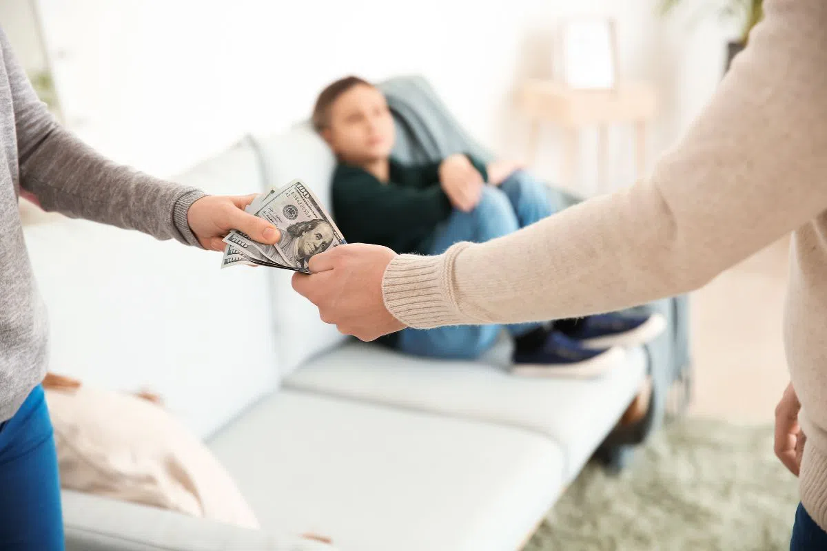 The woman who gets spousal support from her husband.